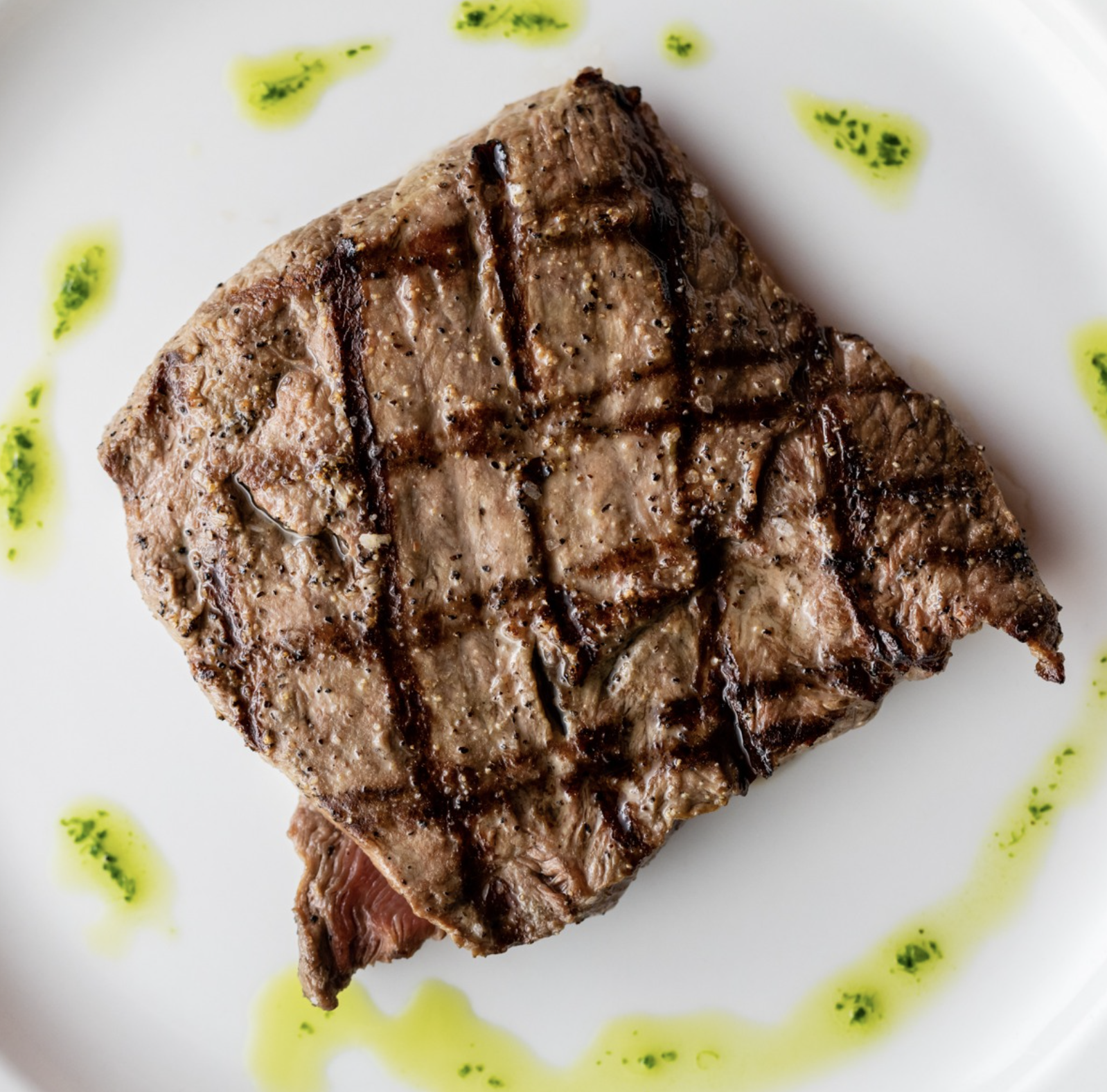 Grilled ribeye steak at Mezzanotte Ristorante